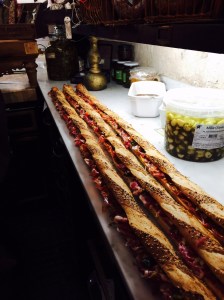 Three Very Long Sandwiches for a Party. Every few inches there were different meats and spreads. You tear the sandwich apart, not cut, just like you would a baguette.